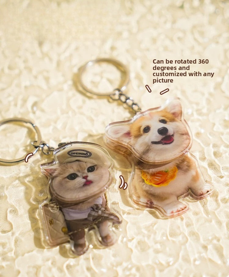 Two keychains shaped like a cat and a dog on a textured beige background.